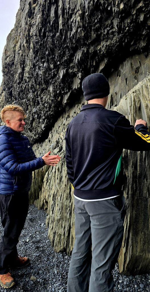 Vic and my son studying the geology and taking a close look at the layers of black/ grey lava.