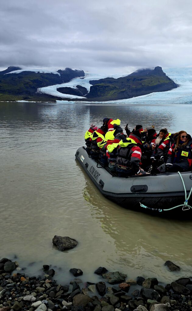 A picture of a boat full of passengers ready to head off into the Lagoon for a close up view of the glacier and floating ice.