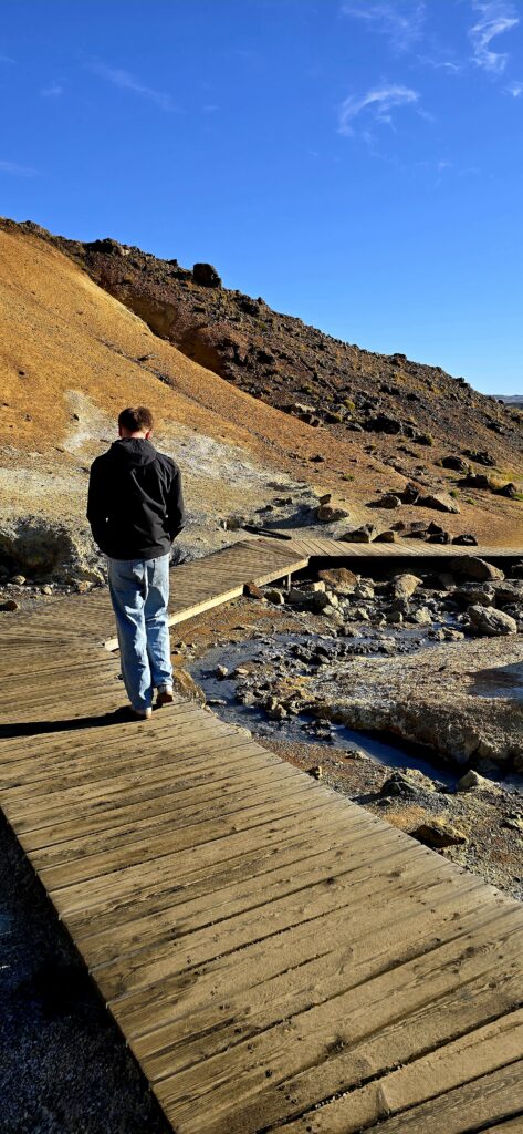 My son walking the path at Seltún Geothermal Area