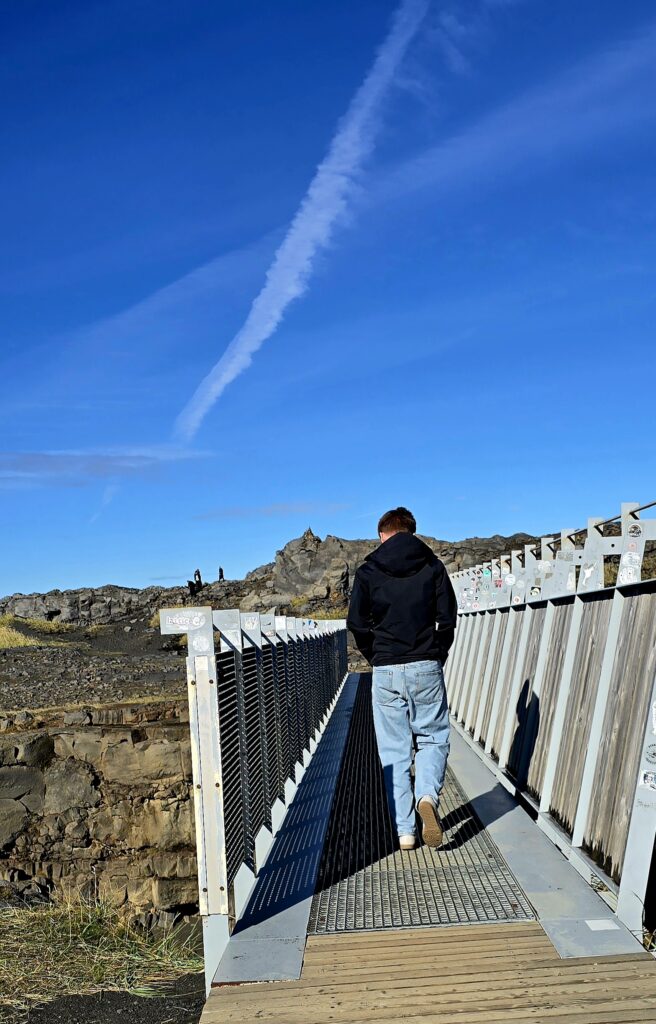 Man walking onto The Bridge Between Two Continents