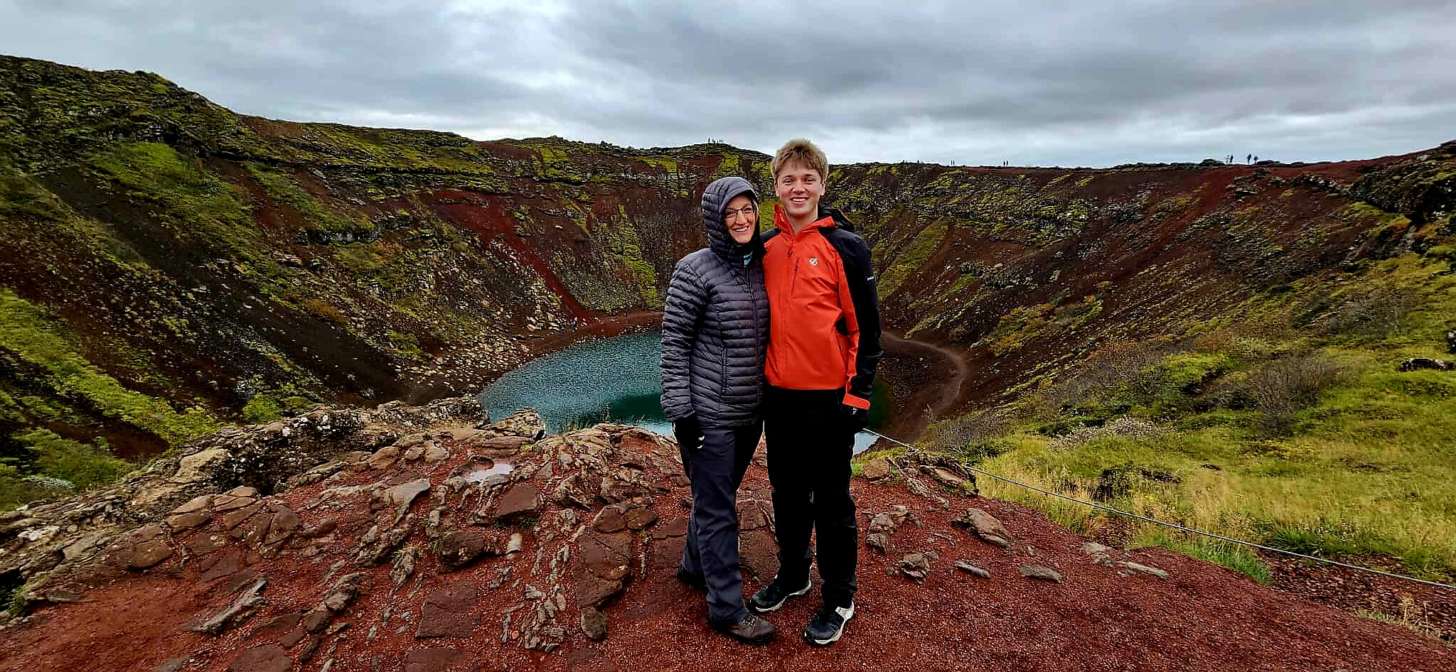 An image of my son and I at the Kerrid Crater. The water is a deep blue green colour and the soil here is very red because of minerals