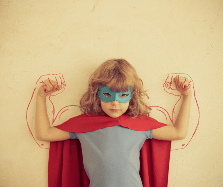 A picture of a girl with strong arms, dressed up as a super hero and looking confident